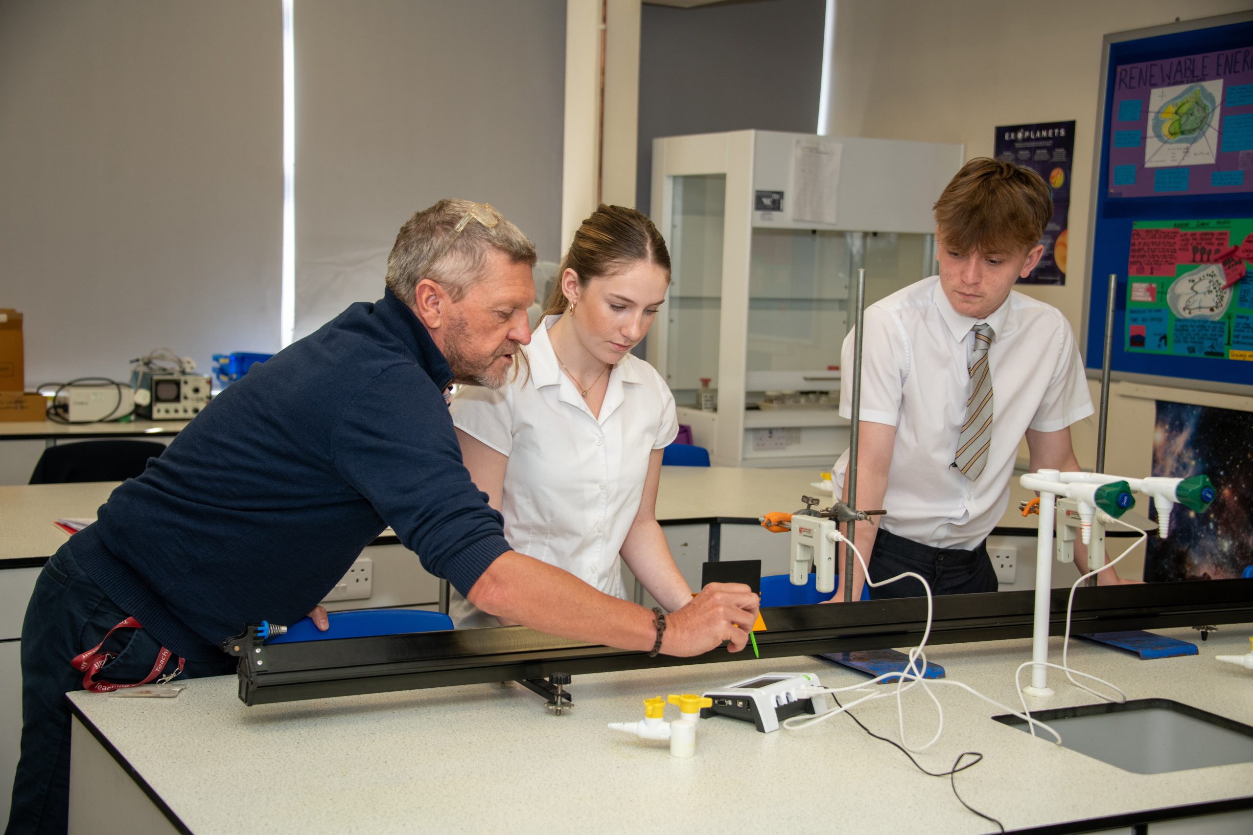 Students and teacher in science class